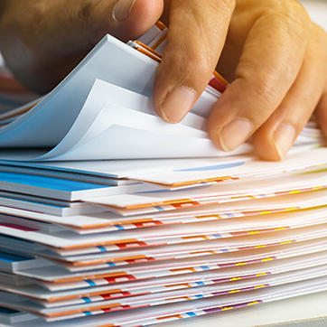 Document Process Outsourcing Case Study - shown by person sorting through papers