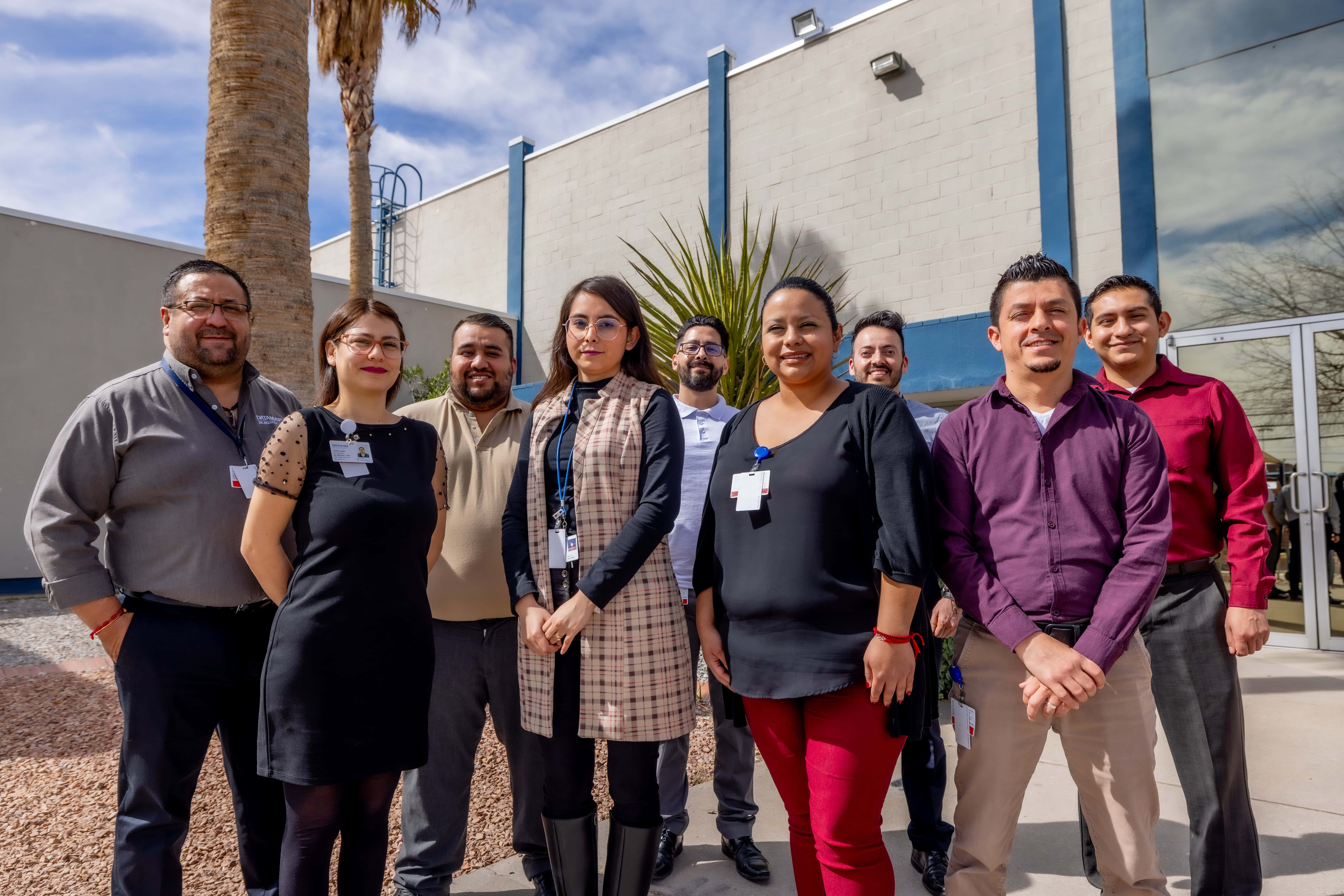 Business process outsourcing team standing outside a contact center facility