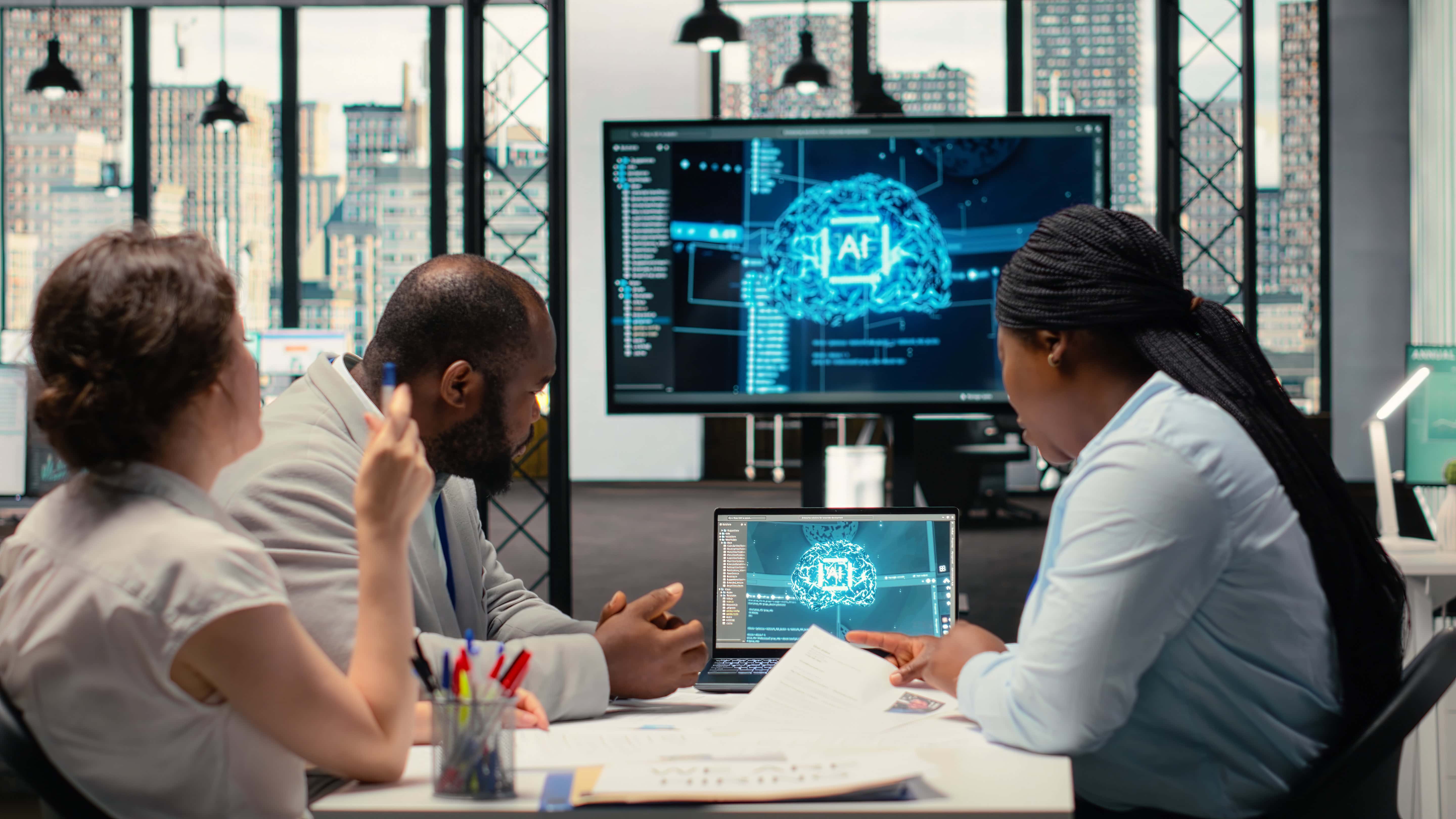 Team reviewing AI program