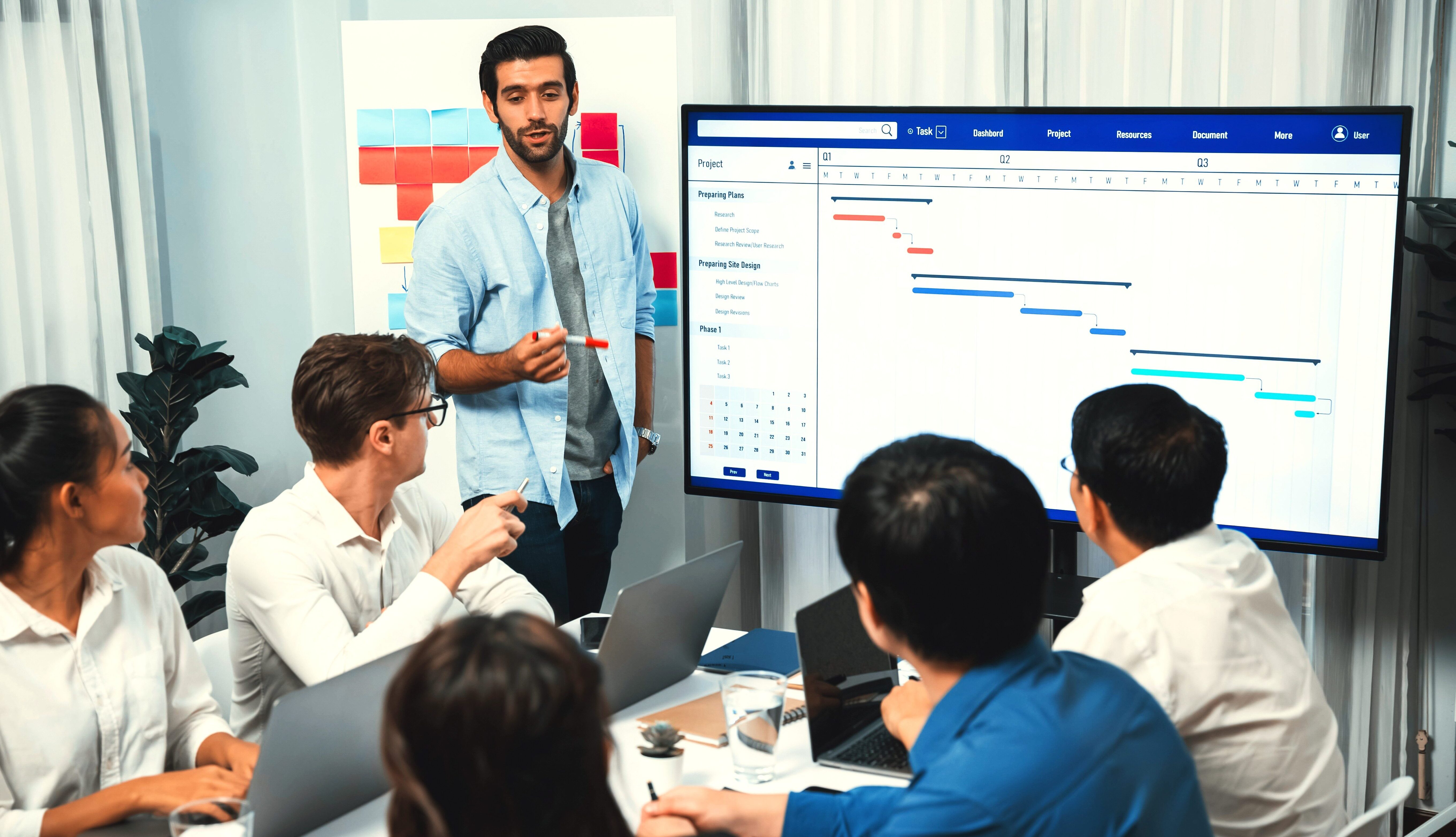 Project management team reviewing plans