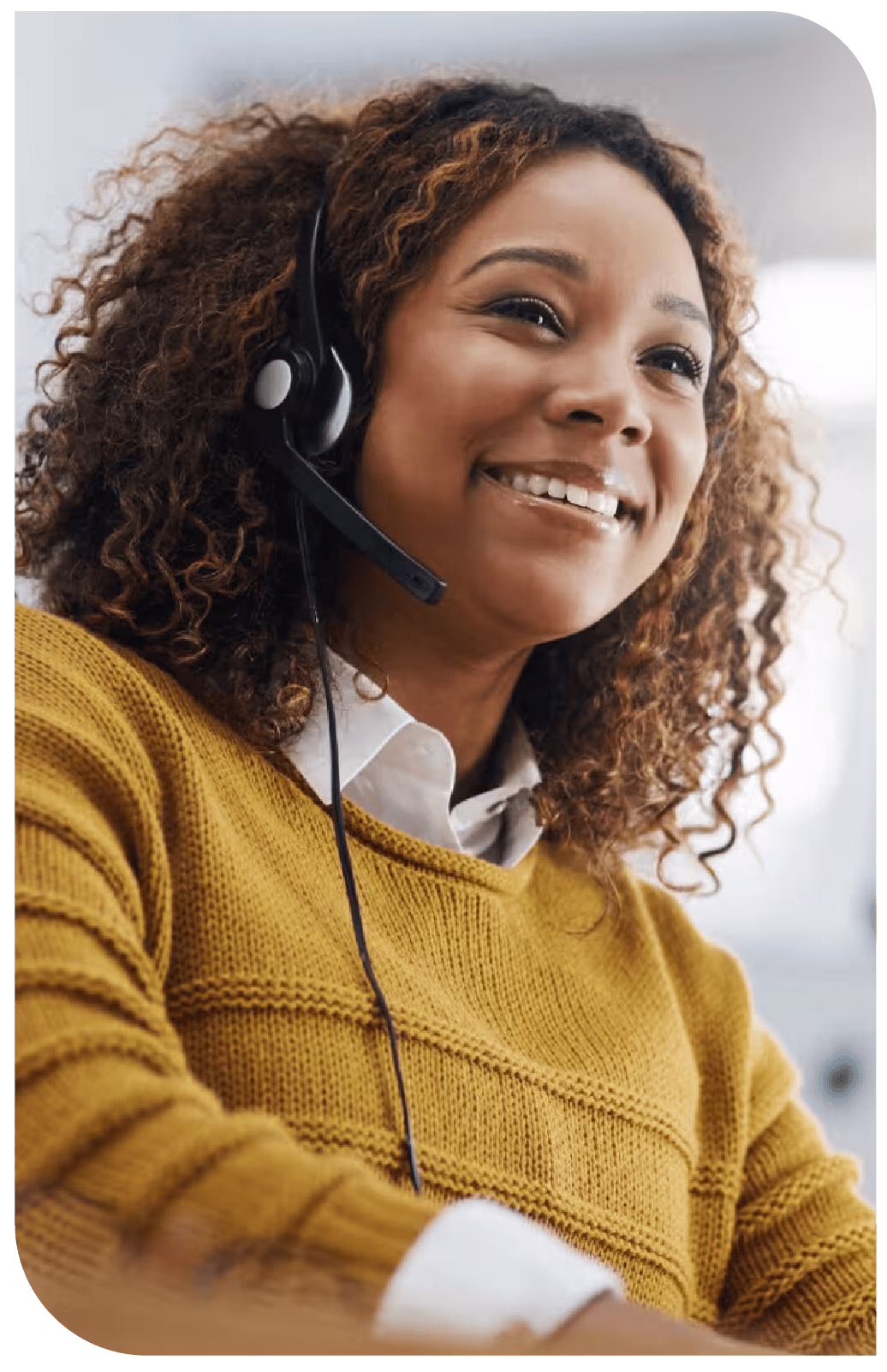 Smiling customer service female representative with a headset on.